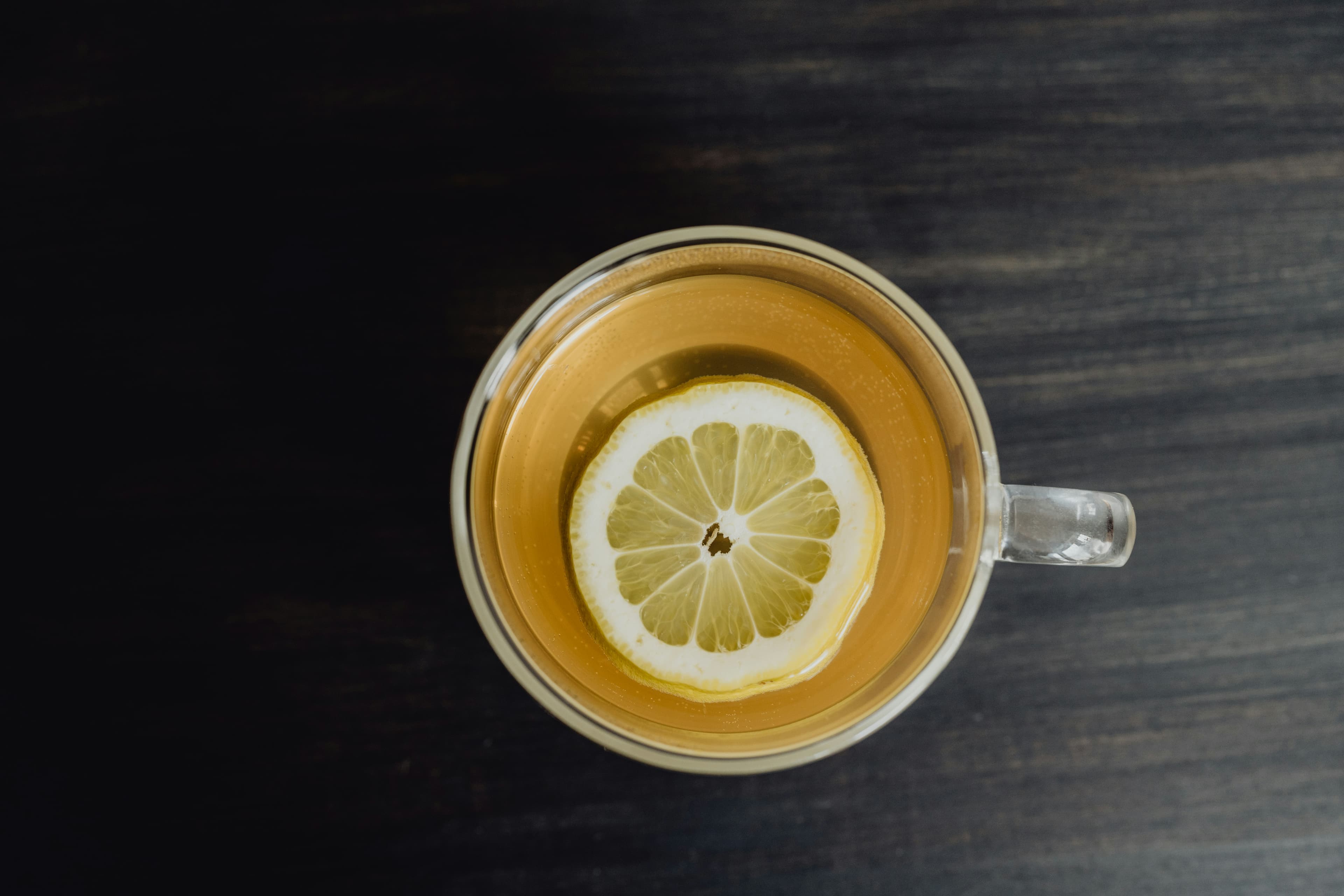 Cup of ginger tea with lemon slice — natural morning sickness remedy — Photo by Kelly Sikkema on Unsplash