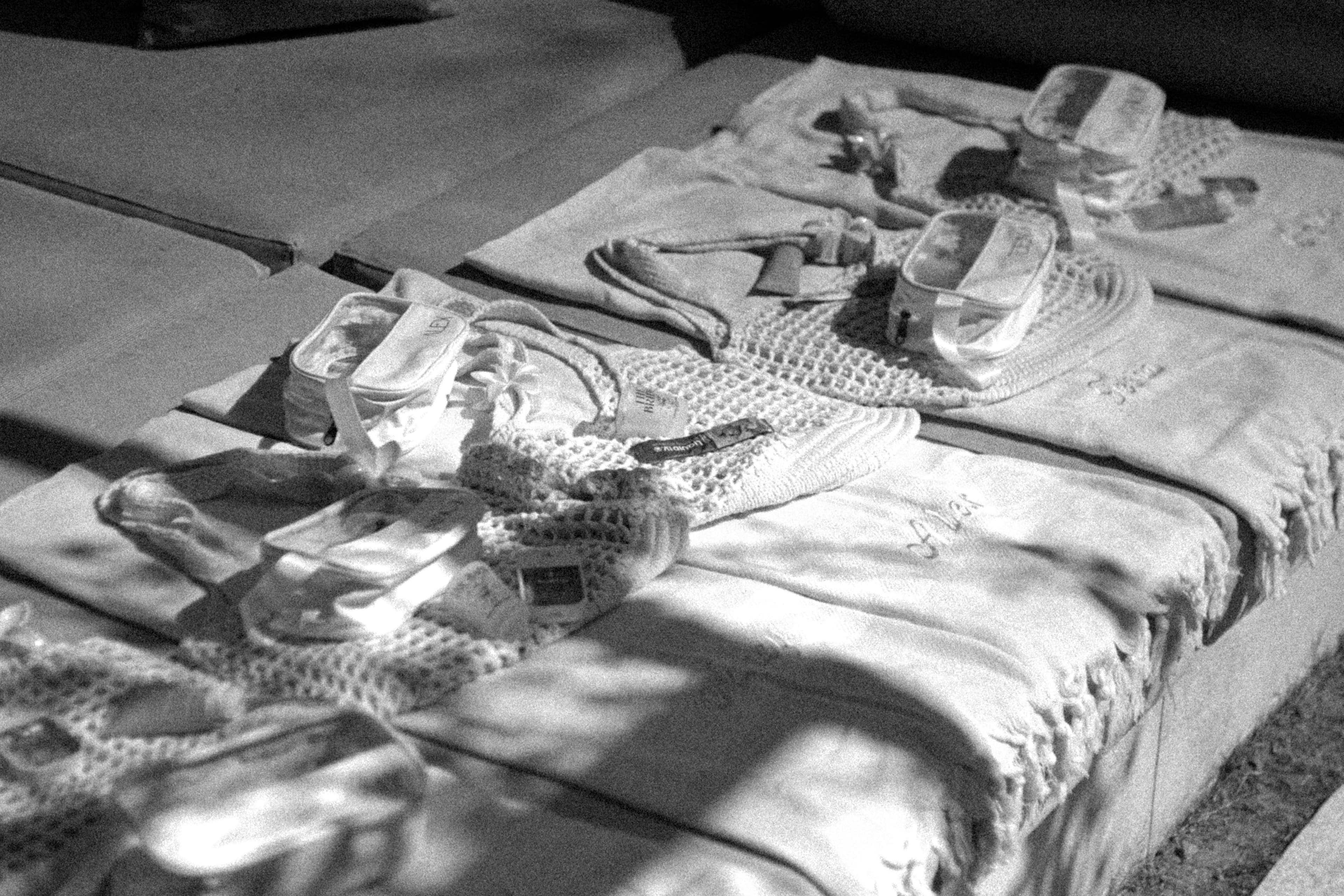 Baby clothes and diapers laid out for hospital bag packing — Photo by Hoi An and Da Nang Photographer on Unsplash